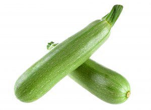 Green zucchini vegetable isolated on white background